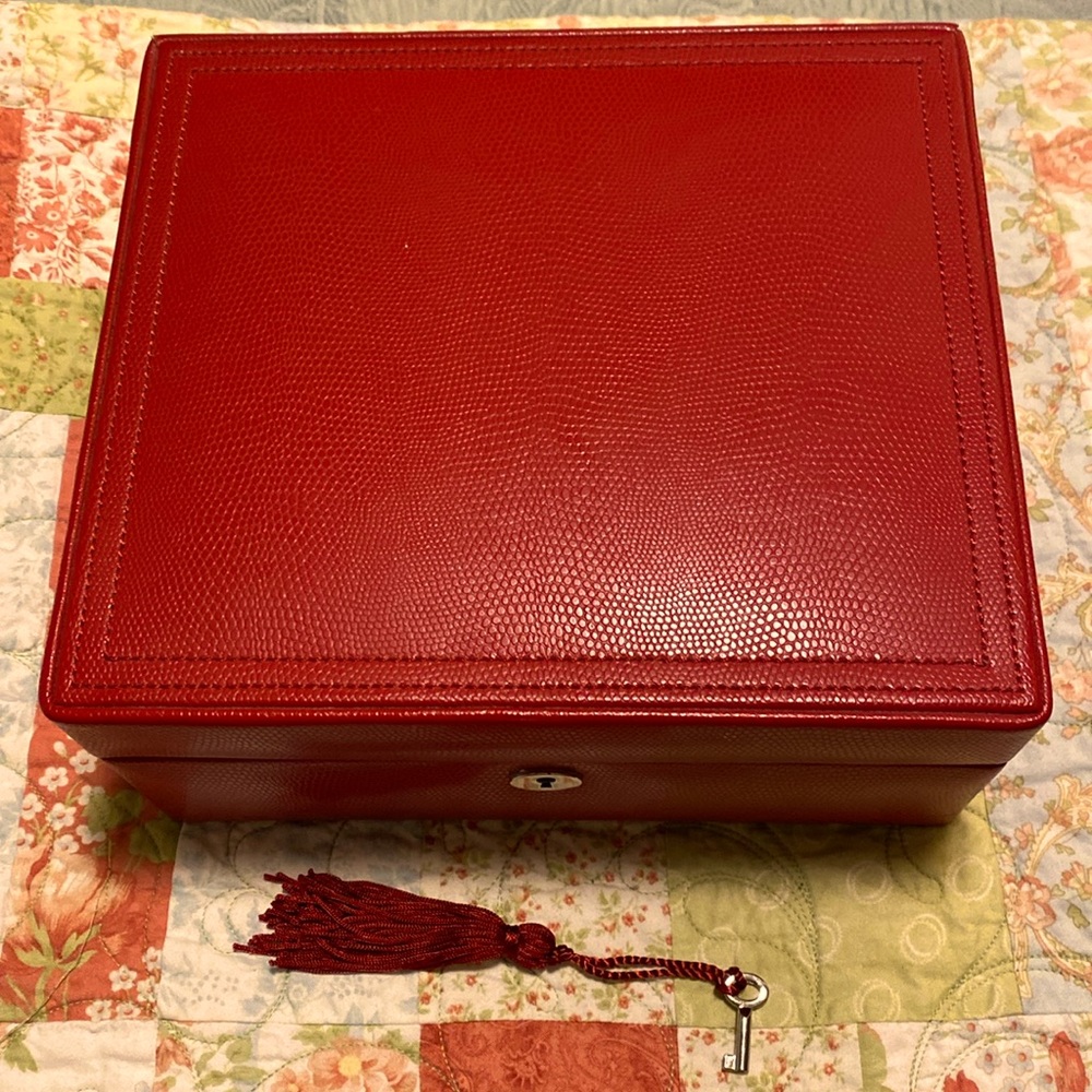 Pottery barn red jewelry box. Never used and is very clean. Has all pieces.